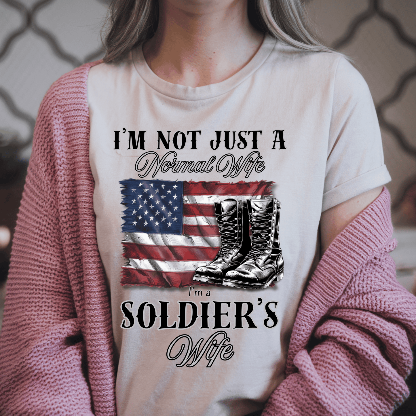 woman wearing patriotic t-shirt the shirt has a flag and army boots that says "Im not Just a normal wife Im a Soldier's wife