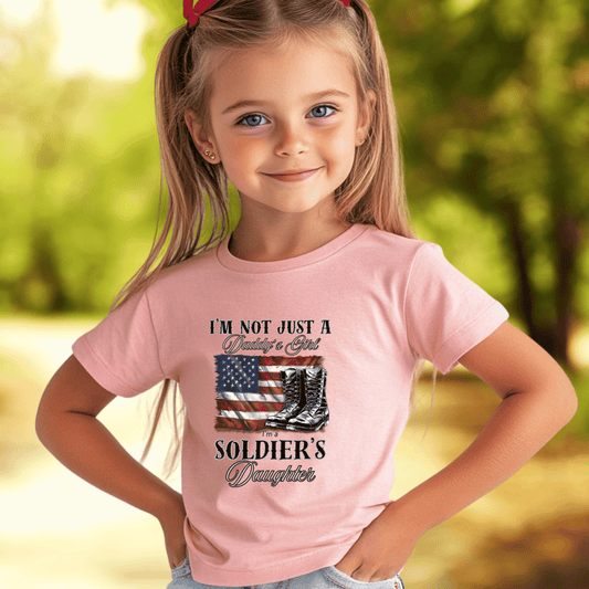 young girl wearing a pink t-hirt that says I'm not just a daddy's girl I am a Soldier's Daughter