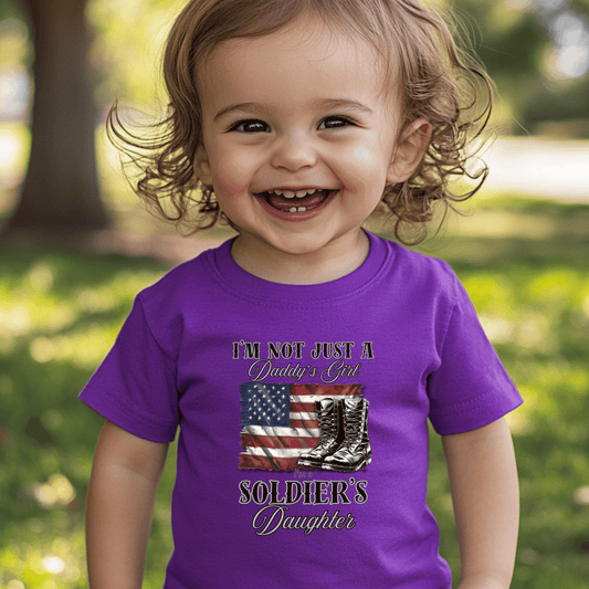 baby wearing a patriotic t-shit with a flag and boots that says I'm not just a daddy's girl I am a Soldier's Daughter