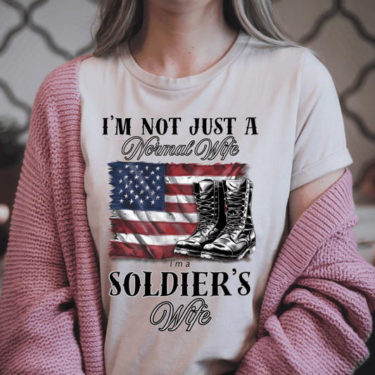 woman wearing patriotic t-shirt the shirt has a flag and army boots that says "Im not Just a normal wife Im a Soldier's wife 