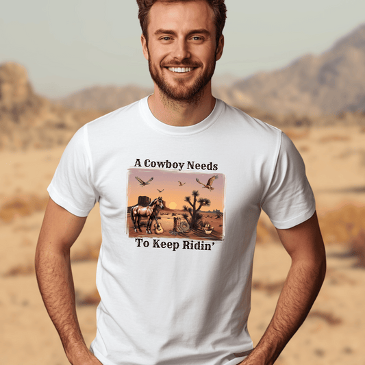 A Cowboy Needs To Keep Ridin' Tee - Western Graphic Shirt for Country Lovers