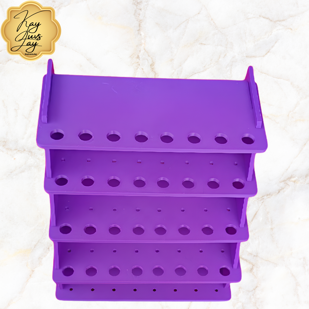 Purple multi-tiered organizer with holes on a textured white background