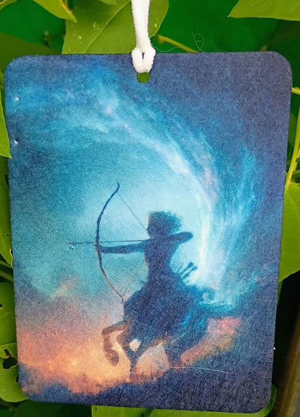 Decorative hanging with archer silhouette against a starry sky on green leaves.