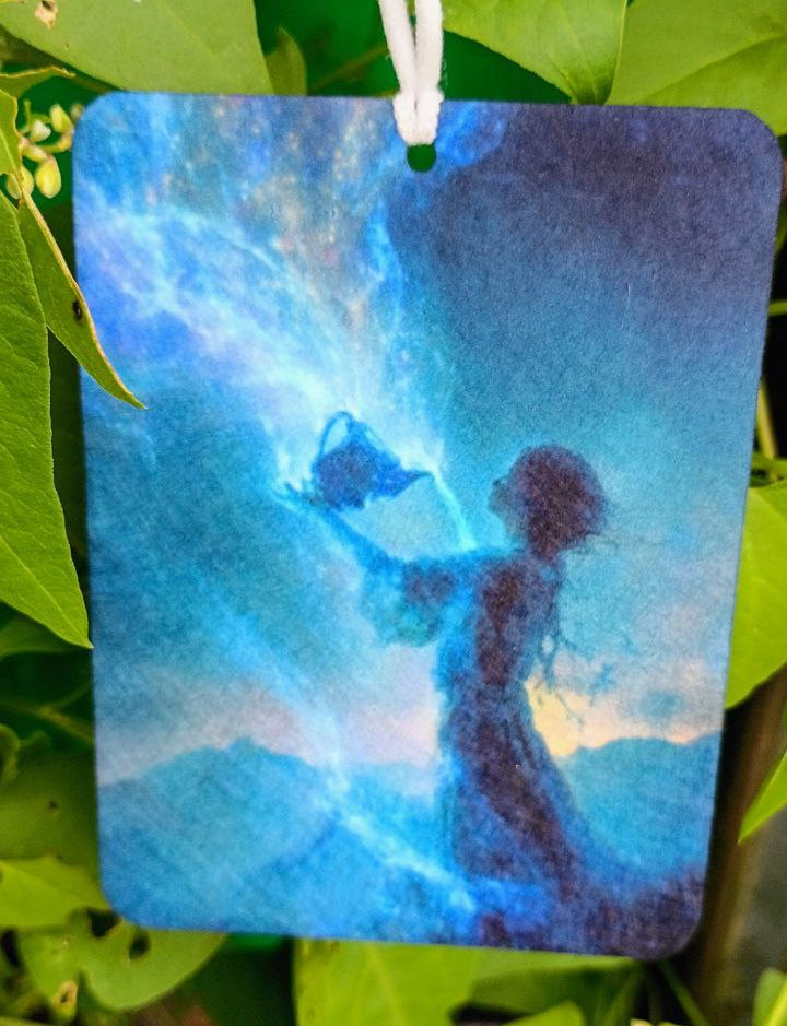 Silhouette of a person holding a blue butterfly against a blue sky, hanging among green leaves.
