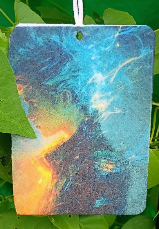 Colorful rectangular object hanging among green leaves
