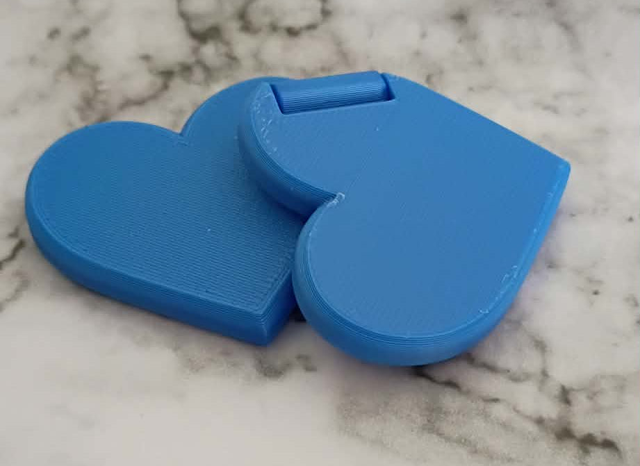 Blue heart-shaped objects on a marble surface